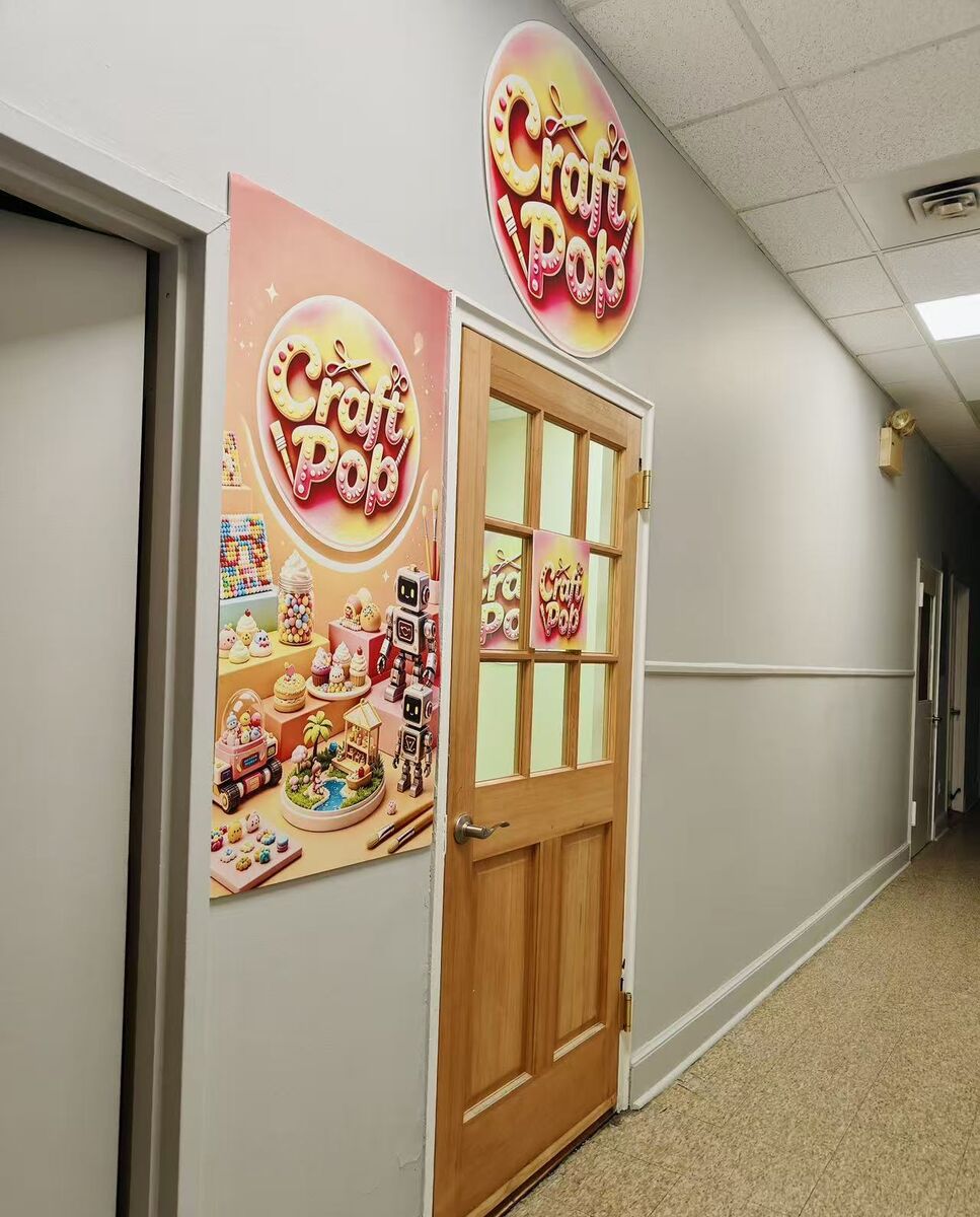 Craft Pop Studio Door - Second Floor Second floor hallway with Craft Pop poster and the studio's wooden door