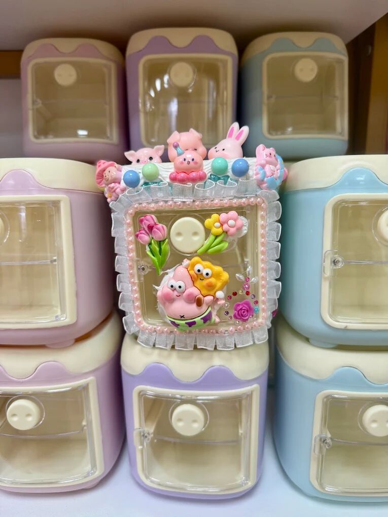 Small box decorated with cream glue, bunnies and flowers