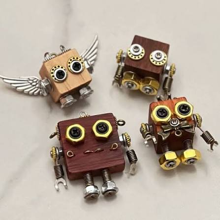 Small wooden punk robots with metal gear eyes, springs and wings